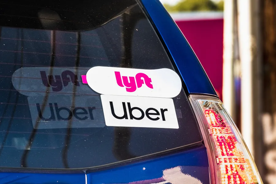 Lyft and Uber stickers on the rear window of a vehicle offering rides in San Francisco Bay Area?w=200&h=150